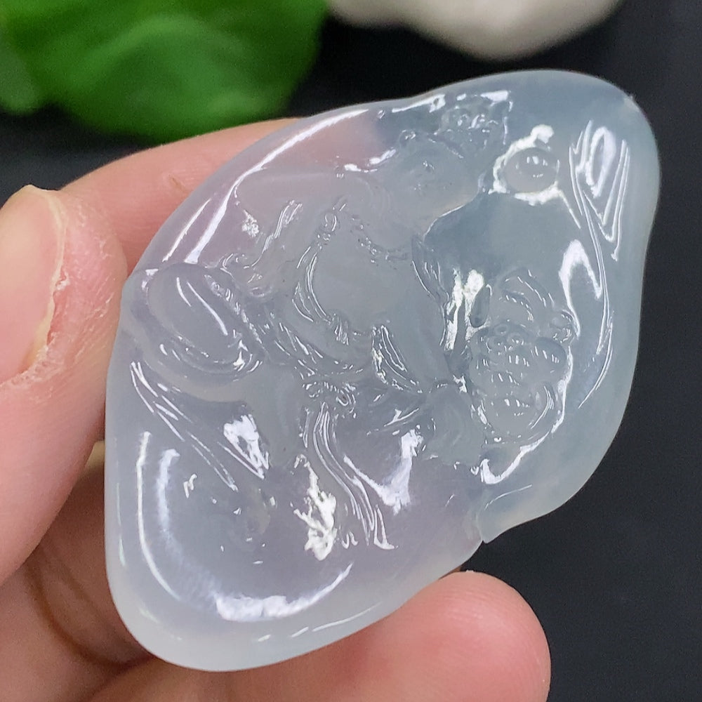 Jadeite Guanyin pendant from HUILIU HQ, carved jade figure weighing approx. 15.9g, detailed craftsmanship and smooth finish.