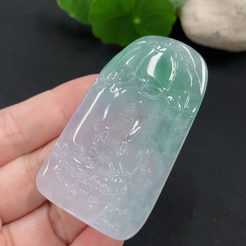 Jadeite Guanyin pendant from HUILIU HQ, intricately carved jade figure weighing approximately 28.8g, displayed against a neutral background.