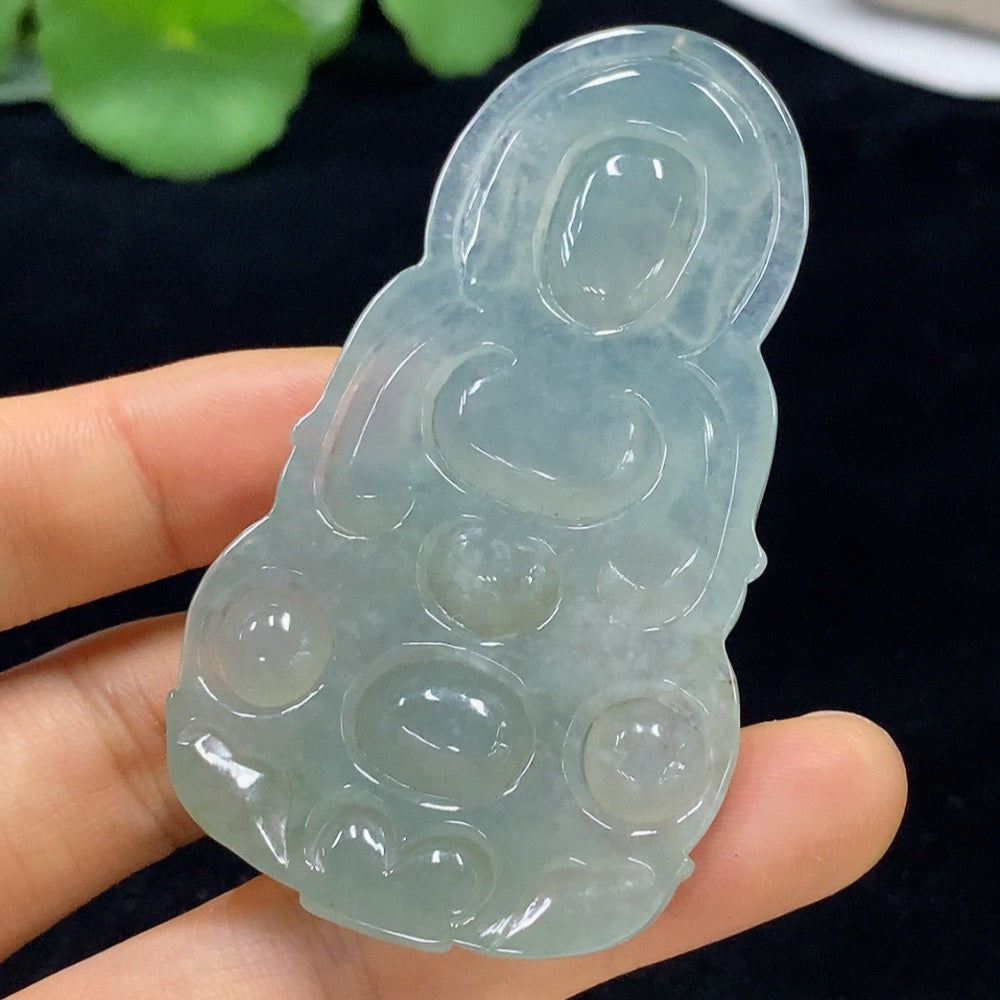 Jadeite Guanyin pendant from HUILIU HQ, intricately carved jade piece weighing approximately 30.36g, showcasing detailed craftsmanship.