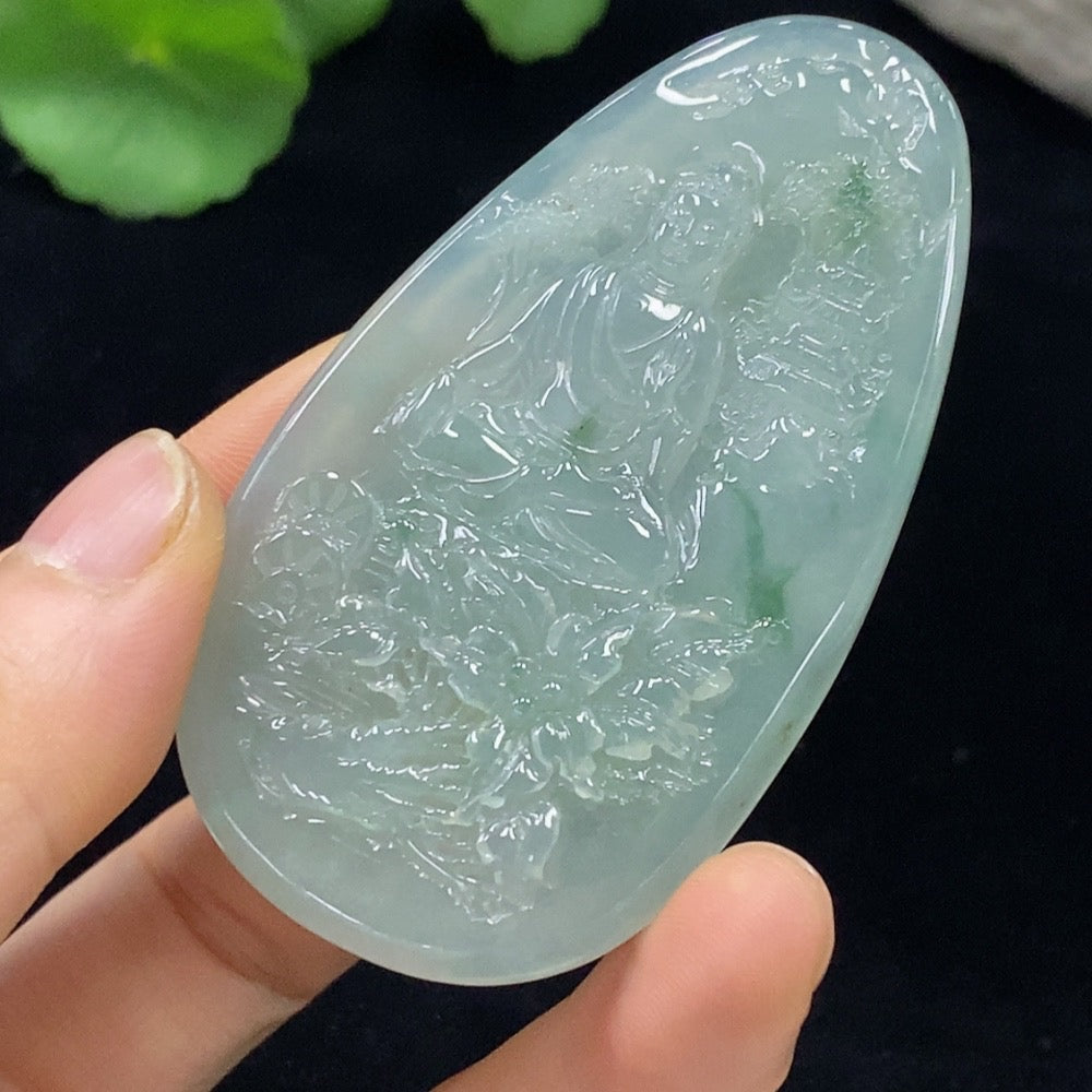 Jadeite Guanyin pendant from HUILIU HQ, featuring a detailed carved figure, weighing approximately 36.45g, on a jade background.