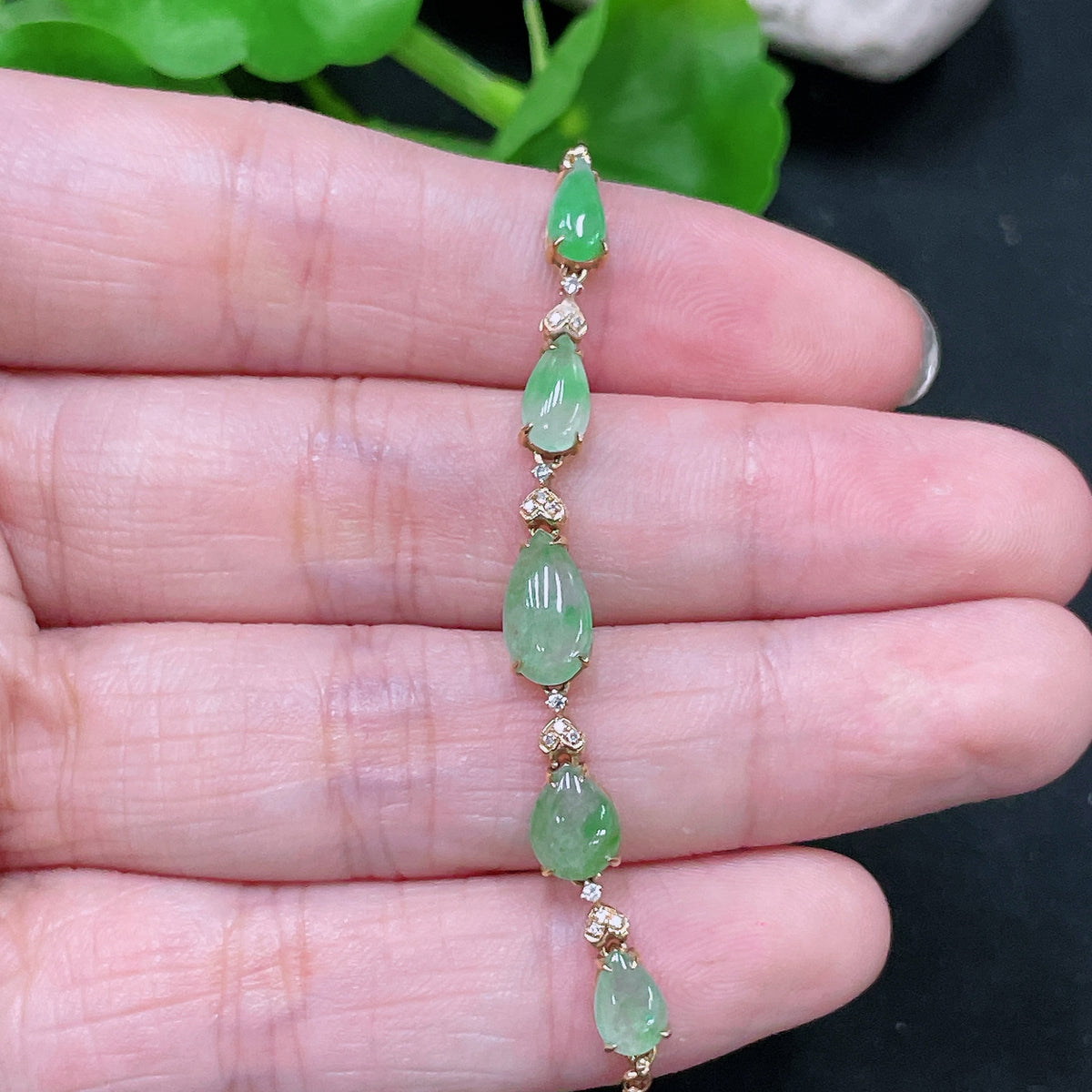 HUILIU HQ Jadeite inlaid bracelet with 18K gold and diamond accents, showcasing intricate craftsmanship and elegant design.