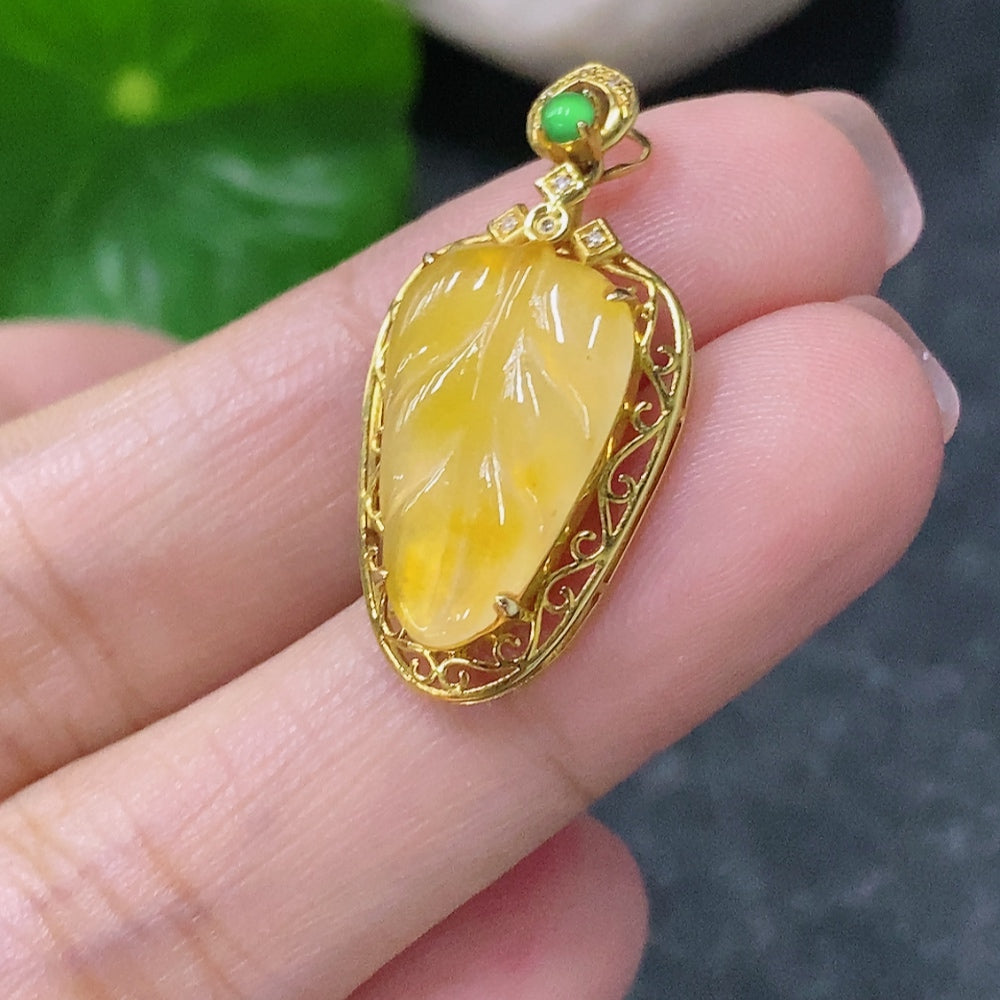 Huiliu Certified Jadeite leaf pendant with inlaid yellow accents and diamond details, showcasing intricate craftsmanship.