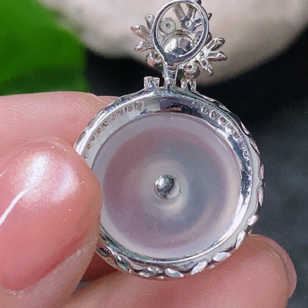 Jadeite peace pendant with 18K gold and diamond accents, showcasing intricate inlay work and a polished jade surface.