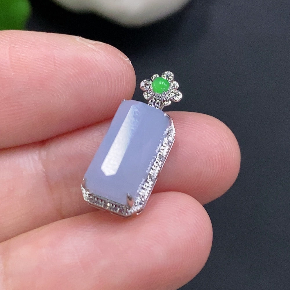 Jadeite inlaid pendant with 18k gold setting from HUILIU HQ, showcasing intricate craftsmanship and a polished jade surface.