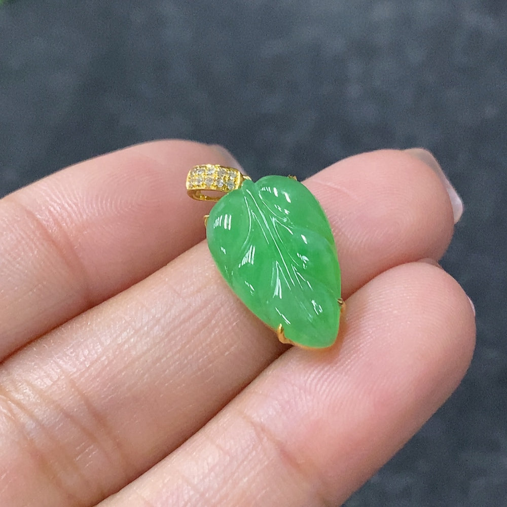 Jadeite leaf pendant with 18K gold and diamond accents, crafted by HUILIU HQ, featuring intricate leaf design and elegant details.
