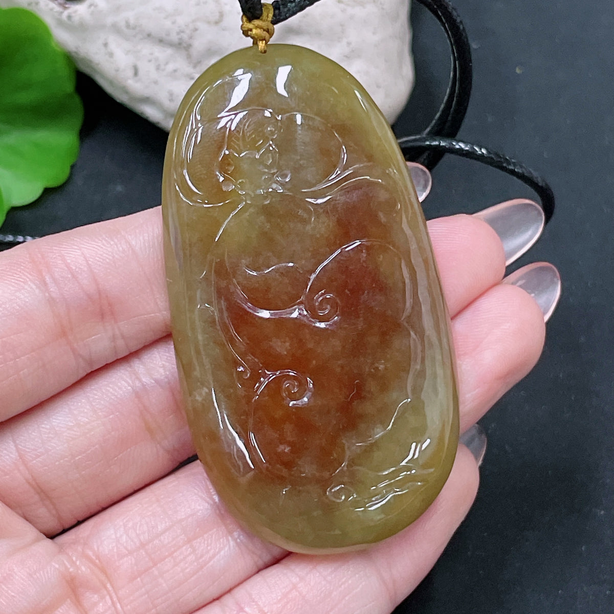 HUILIU HQ jadeite lotus pendant weighing approx. 36.65g with yellow-colored jade, displayed with rope, natural and detailed close-up.