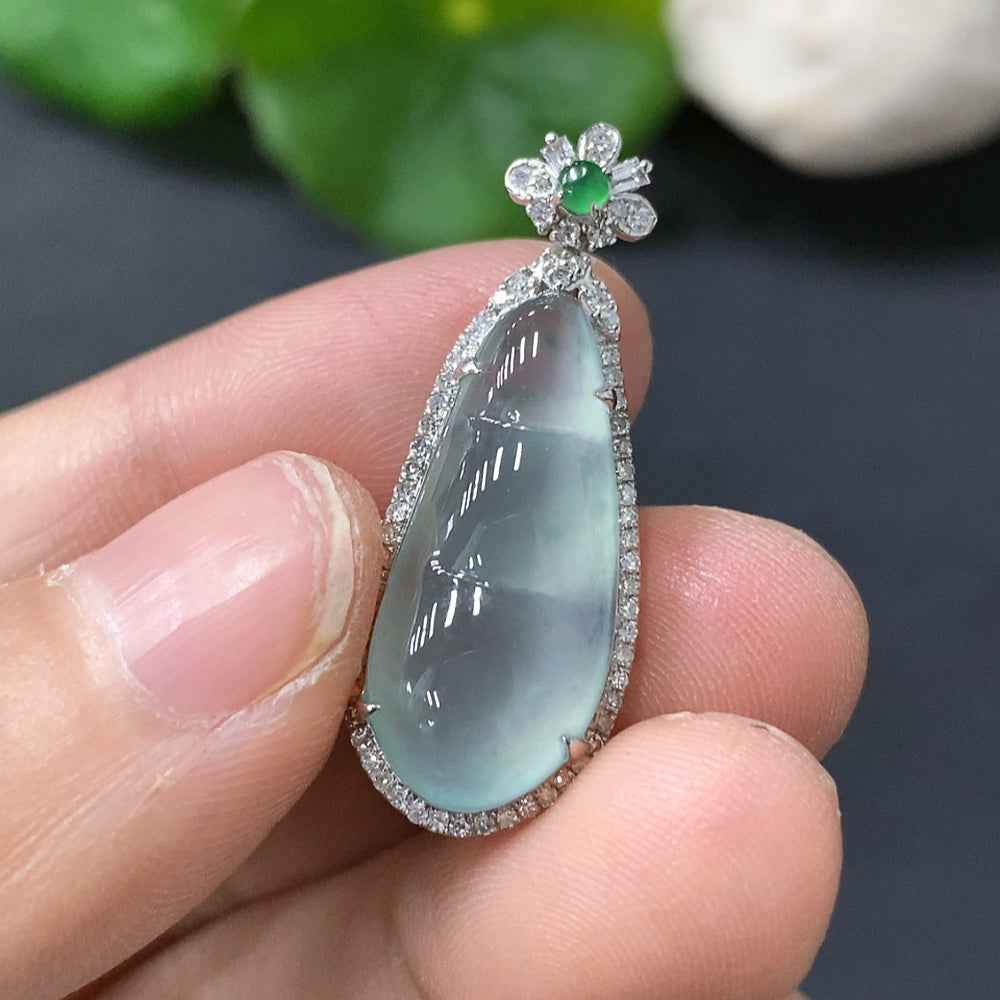 Jadeite lucky bean pendant with 18K gold setting, crafted by HUILIU HQ, featuring a smooth, polished green jade bean.