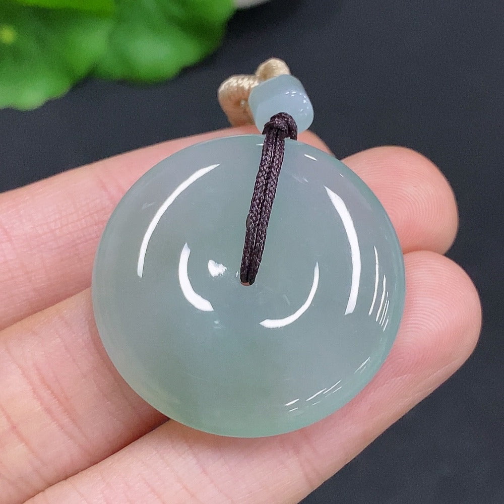 HUILIU HQ jadeite peace knot pendant weighing approximately 14g with rope, featuring intricate jade carving and smooth finish.