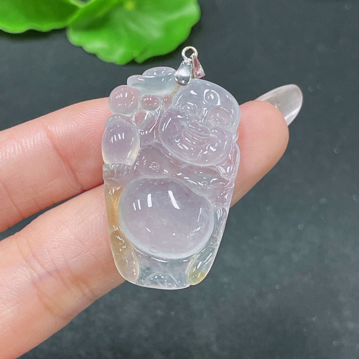 Jadeite pendant featuring Buddha design in 18k bezel, weighs approximately 8.08g, crafted by HUILIU HQ.