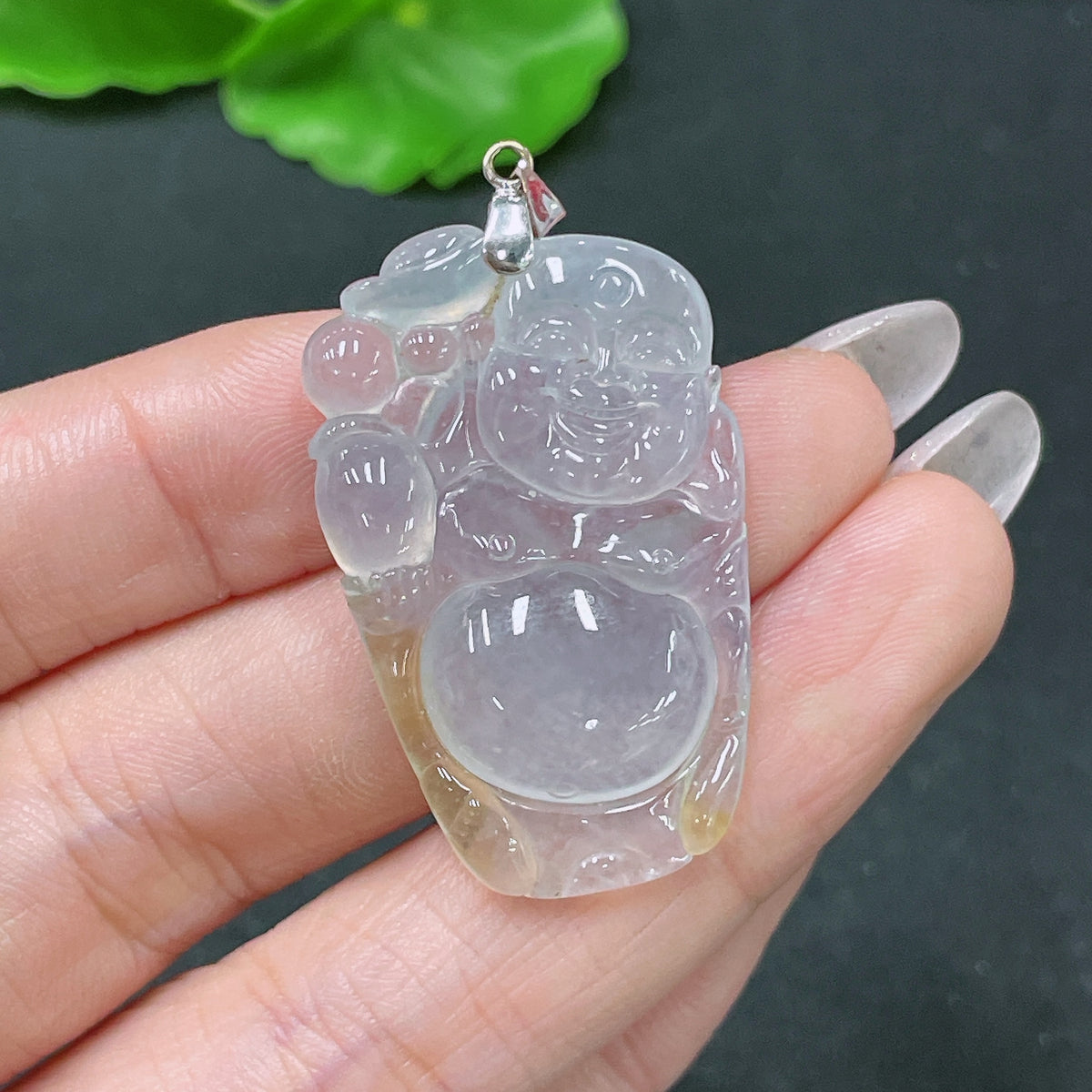 Jadeite pendant featuring Buddha carved in jade with 18k gold bezel, weighing approximately 8.08 grams, by HUILIU HQ.