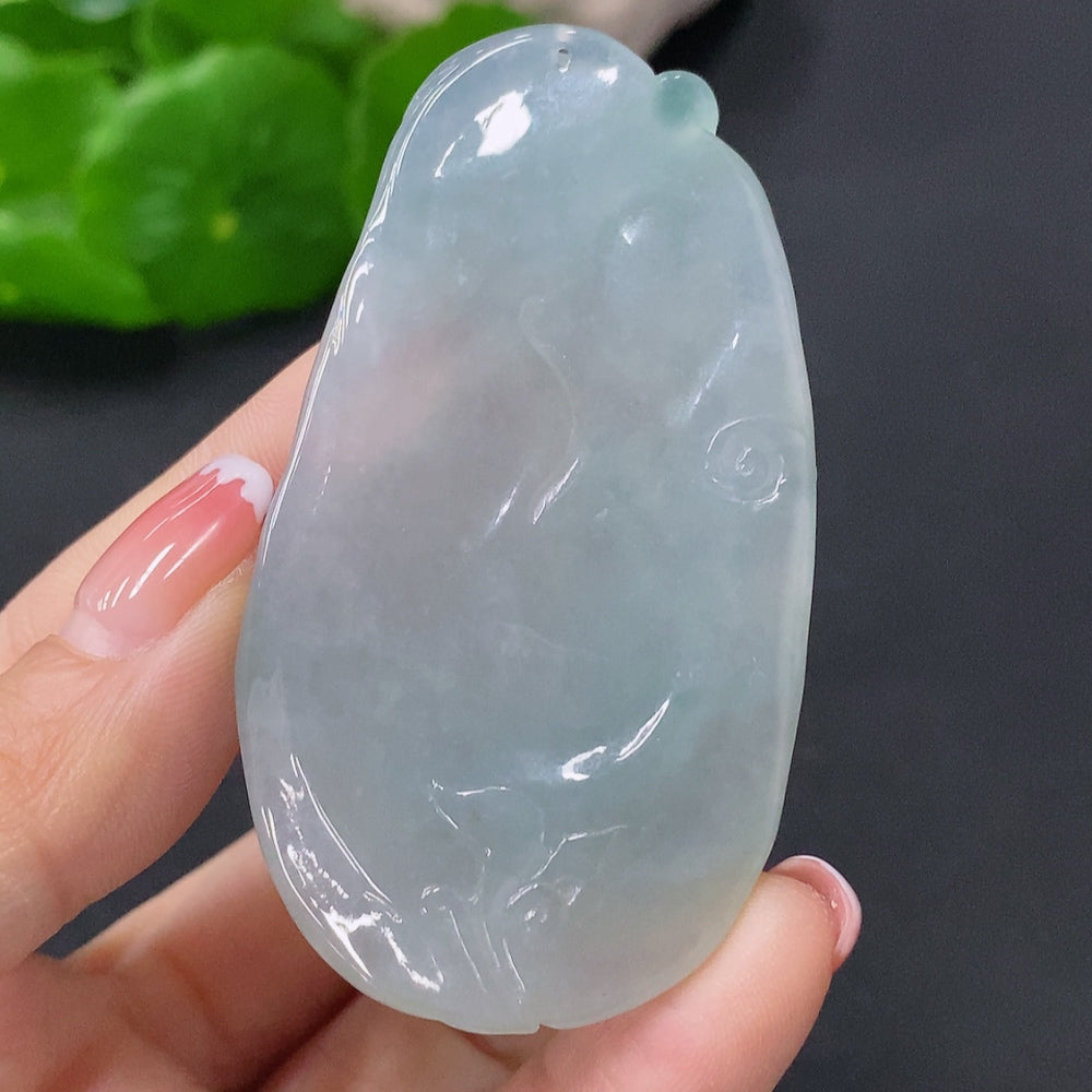 Jadeite Buddha pendant in green jade, crafted by HUILIU HQ, featuring a detailed seated Buddha figure on a polished jade background.