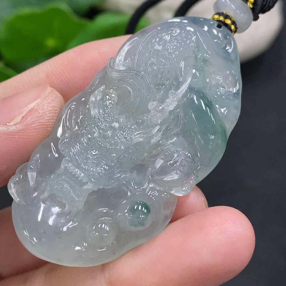 Jadeite pendant with dragon plaque and cord from HUILIU HQ, weighing approximately 27.4g, featuring intricate jade dragon design.