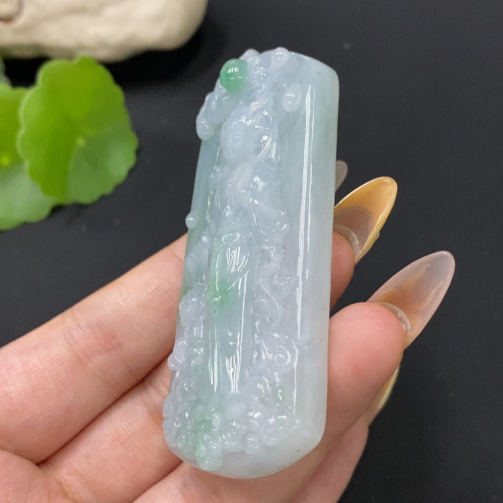 Jadeite Guanyin pendant weighing approximately 58.34g, crafted by HUILIU HQ, featuring detailed carved figure on smooth jade surface.