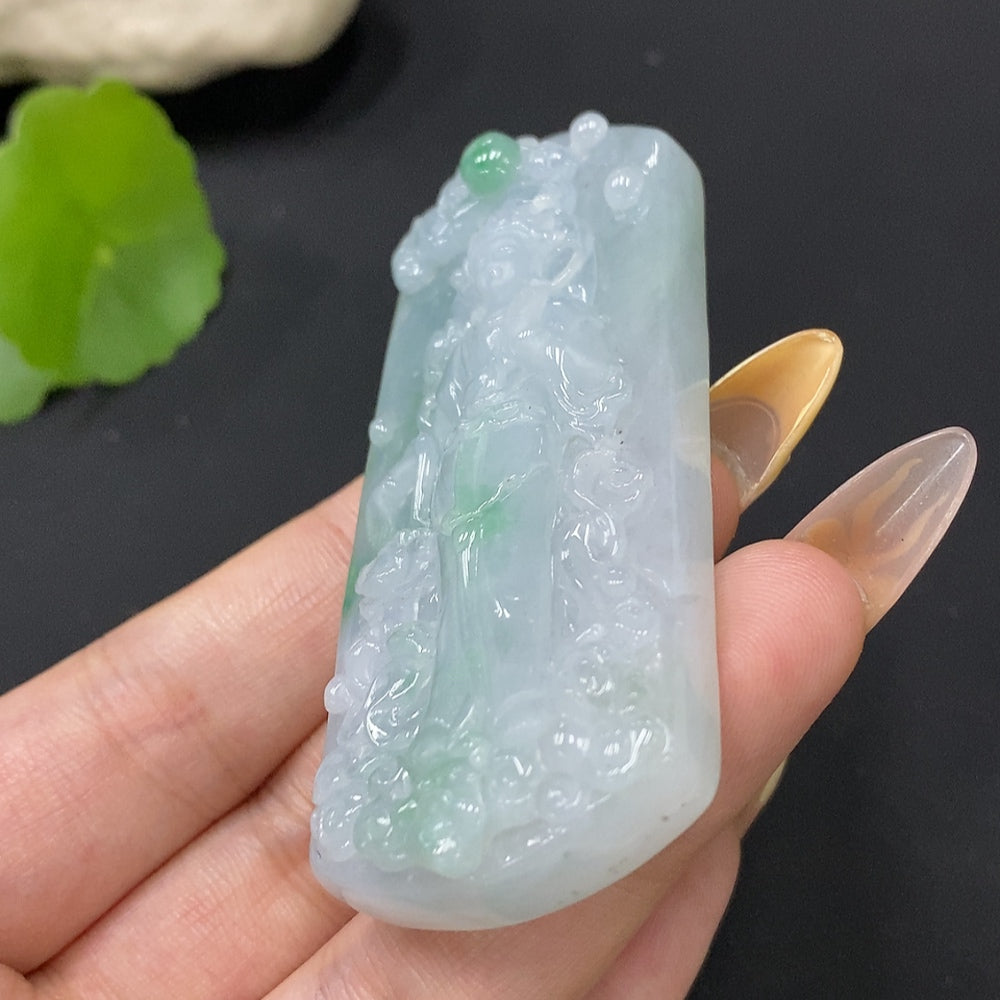 Jadeite pendant featuring Guanyin figure, crafted from green jade, weighs approximately 58.34g, with intricate carved detailing.