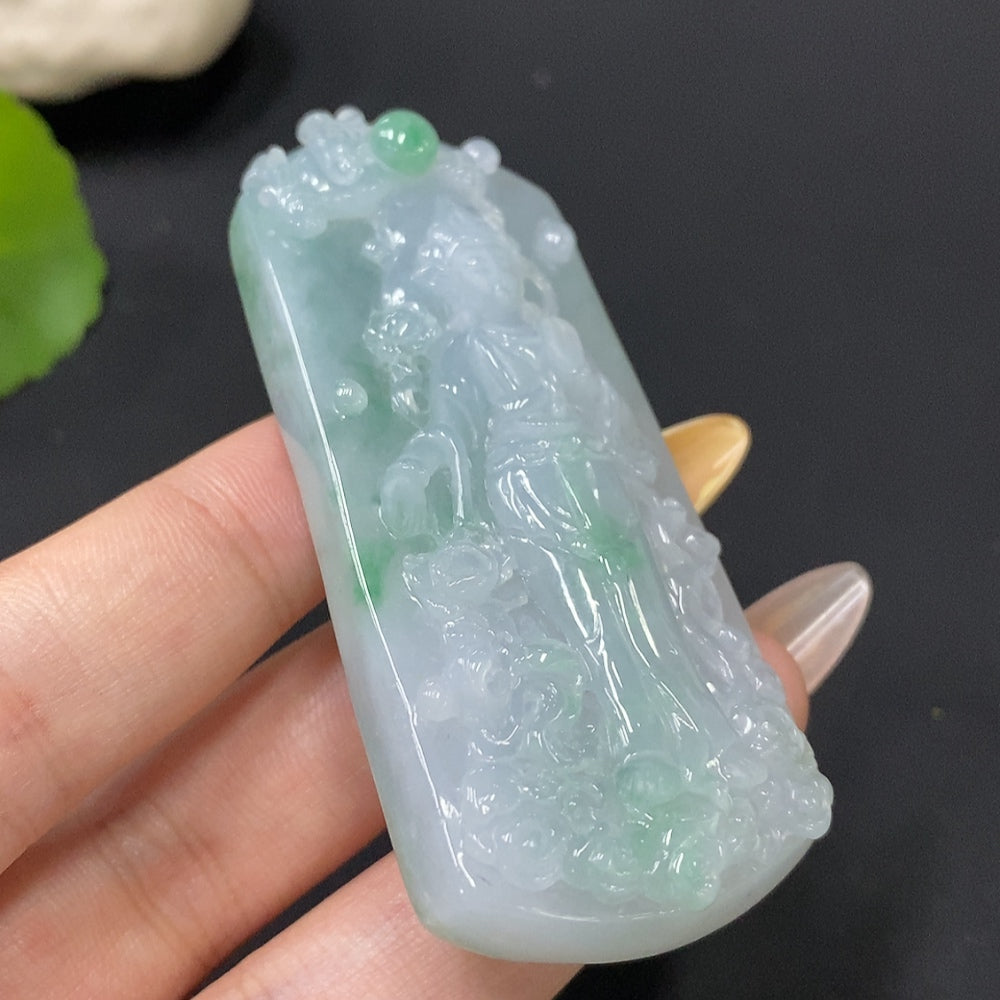 Jadeite Guanyin pendant weighing approximately 58.34g, crafted from green jade, featuring detailed carved figure.