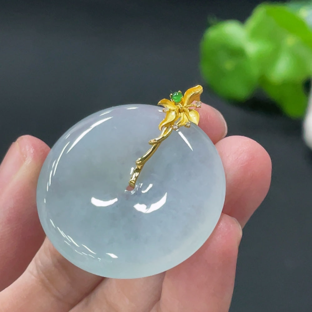 Huiliu jadeite pendant with peace knot design and diamond accents, featuring a polished jade stone and intricate craftsmanship.