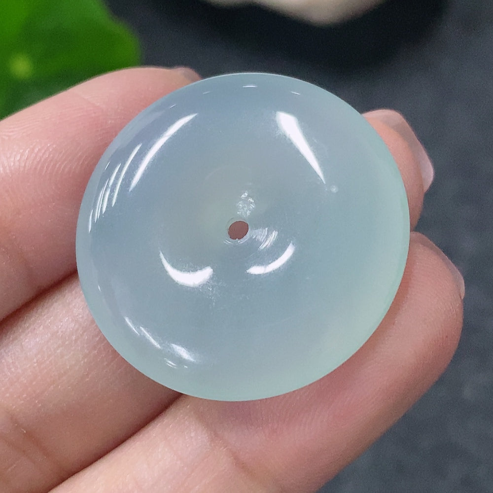 Huiliu HQ jadeite peace ring pendant featuring a smooth green jadeite jade with carved details, certified by Huiliu.