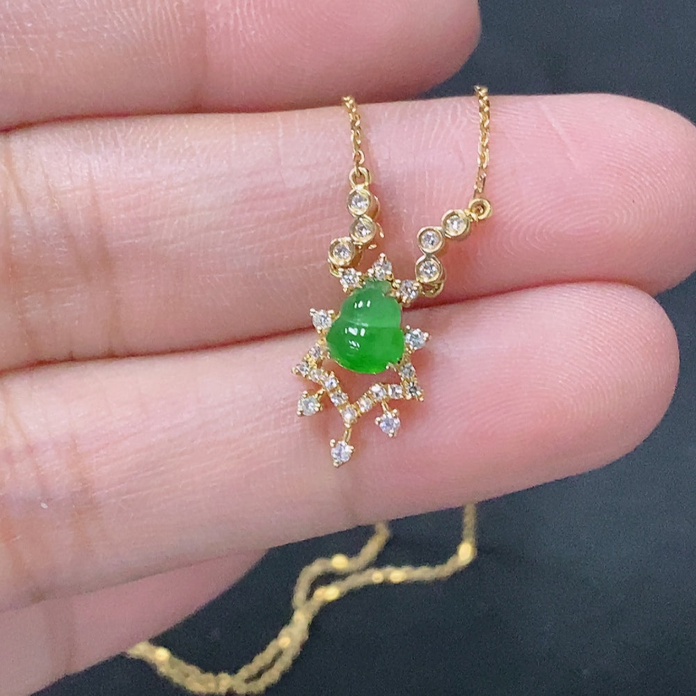 HUILIU HQ jadeite pendant with 18K gold accents and diamond details, shown on a chain, weighing approximately 2.25 grams.