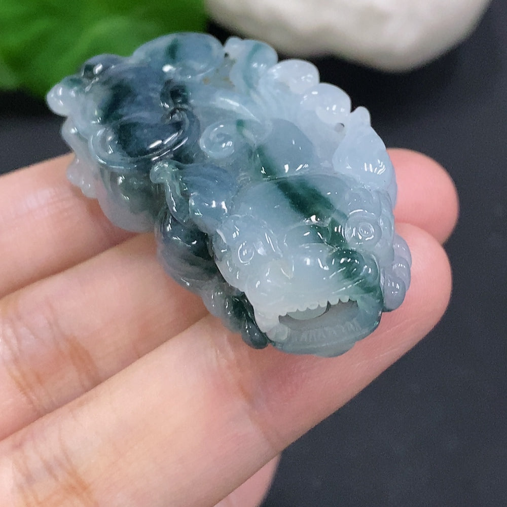 Huiliu Certified Jadeite Pi Xiu pendant featuring intricate carving, showcasing a traditional Chinese mythical creature in smooth jade.