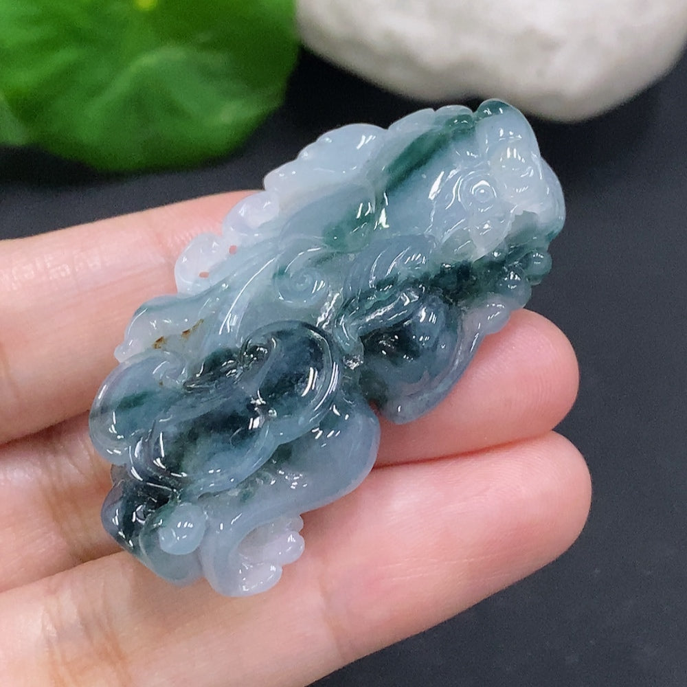 Huiliu Jadeite Pi Xiu pendant featuring a detailed carved jade design, Huiliu certified, on a white background