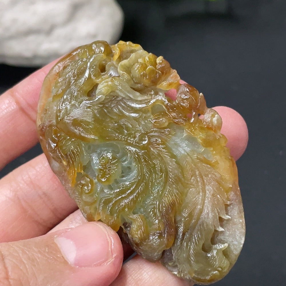 Huiliu HQ jadeite rough phoenix pendant with undetermined color origin, showcasing natural jade stone and intricate design.