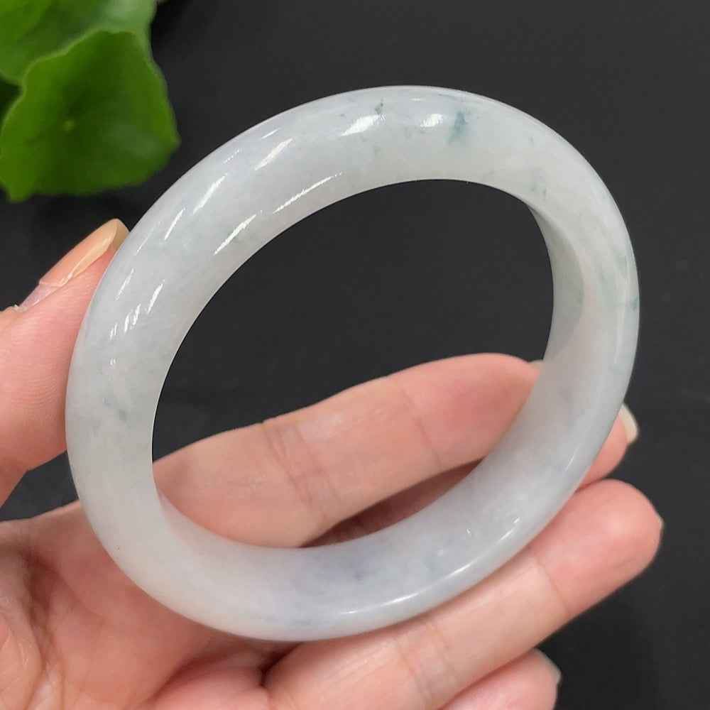 Huiliu HQ jadeite round bangle, certified jade jewelry with smooth, polished surface and vibrant green color.