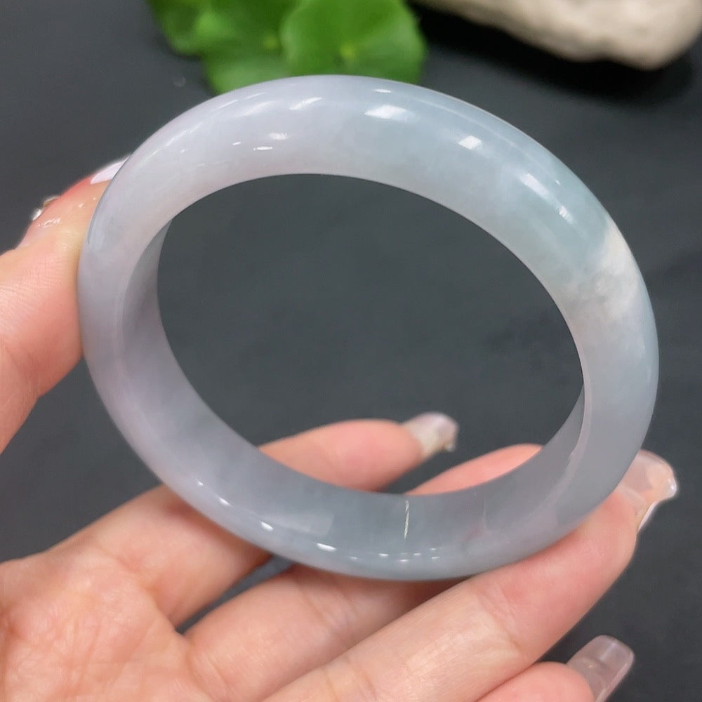 Huiliu HQ jadeite round bangle crafted from green jade, showcasing smooth, polished surface and traditional circular design.