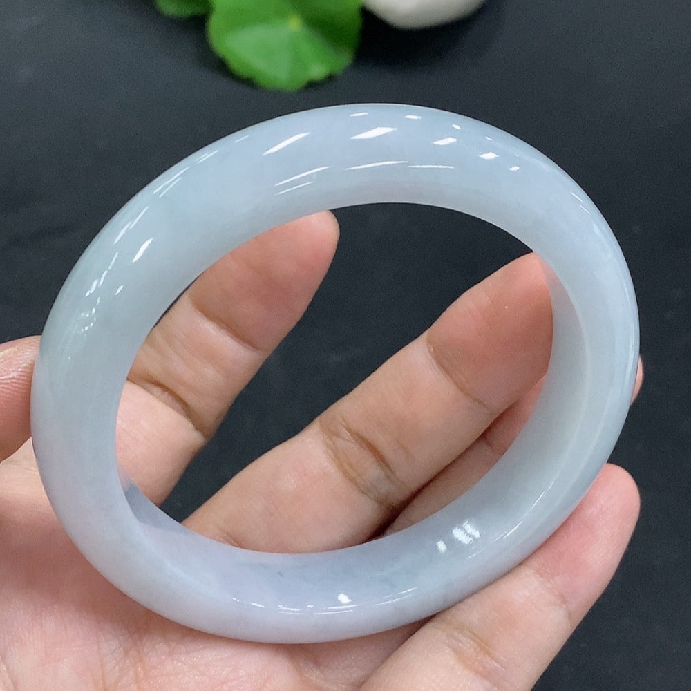 Huiliu Certified Jadeite Round Bangle, smooth green jade bracelet with polished finish, showcasing traditional craftsmanship.