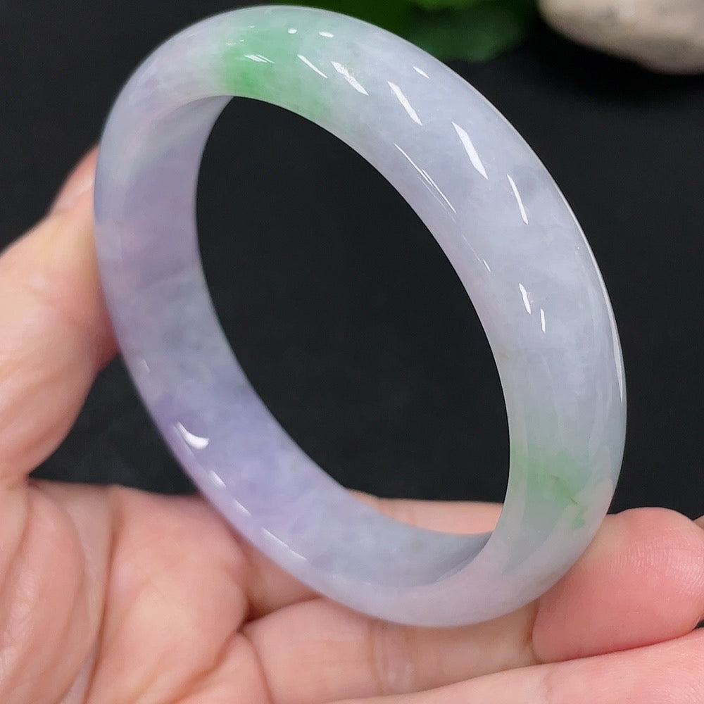 HUILIU HQ jadeite round bangle in size 56, weighing approximately 52.3g, showcasing a smooth, polished jade surface.