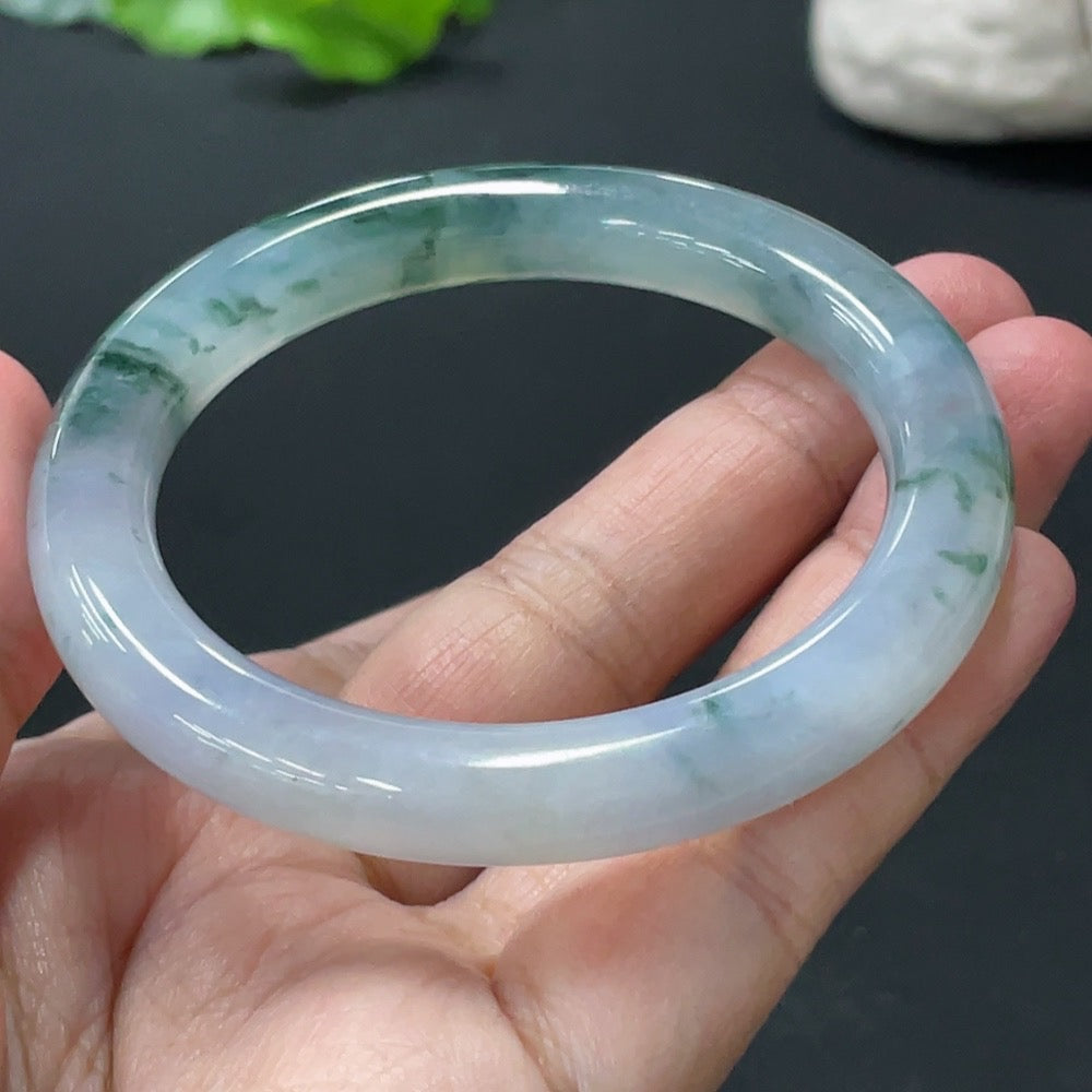 Jadeite round bangle by HUILIU HQ, smooth green jade, 42.79g weight, size 52.5 mm, showcasing polished surface and rounded shape.