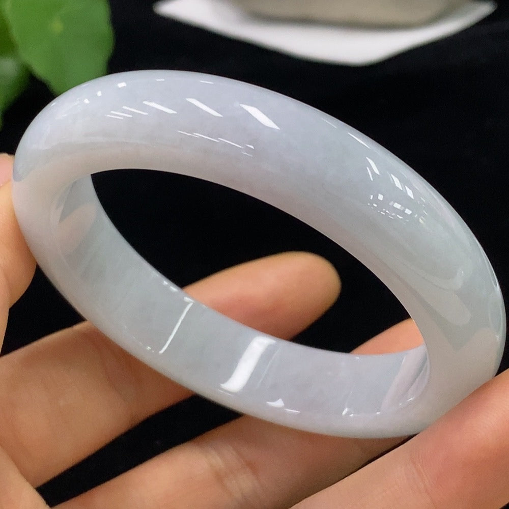 Huiliu Certified Jadeite round bracelet showcasing smooth, polished jade beads with natural green hues on a white background.