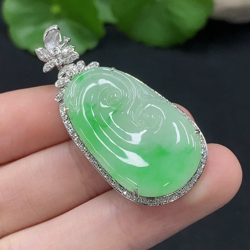 Jadeite Ruyi pendant in 18K gold with diamond accents, crafted with intricate inlay, weighing approximately 6.57g.