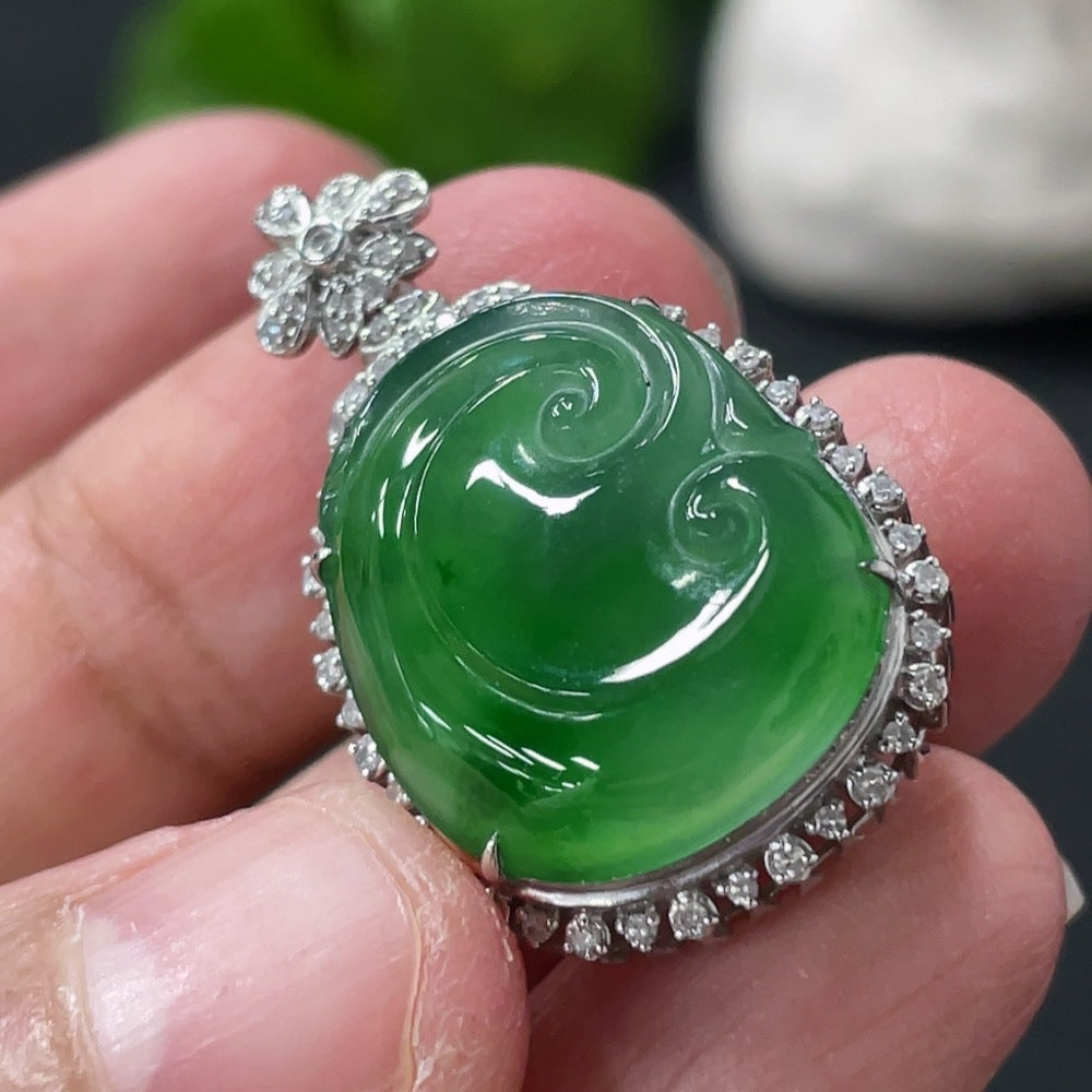 Jadeite Ruyi pendant with 18K gold and diamond accents, shown with intricate inlay and elegant design on a white background.