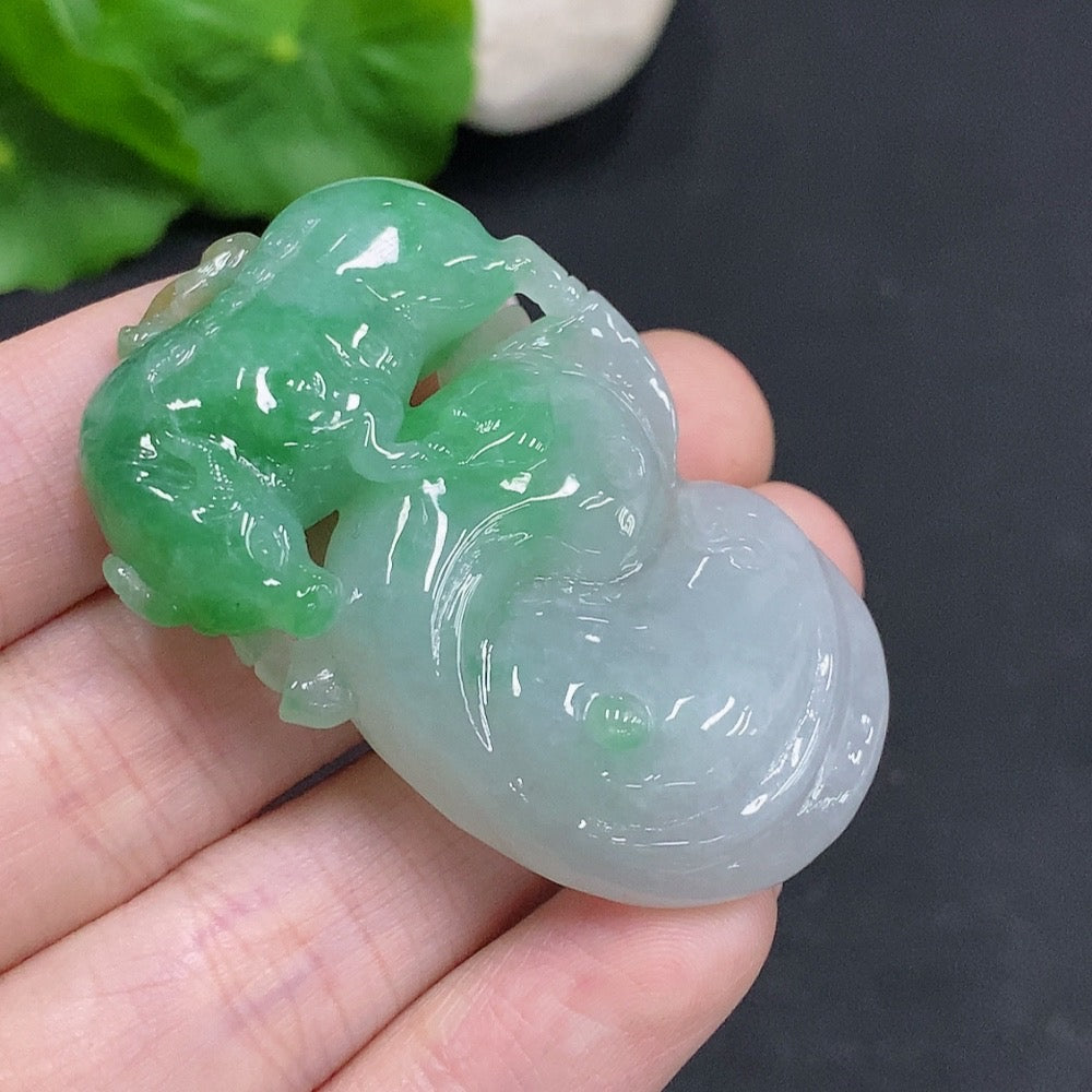 Huiliu Jadeite Turn the Tide pendant featuring a polished jadeite design with Huiliu certification, displayed on a neutral background.