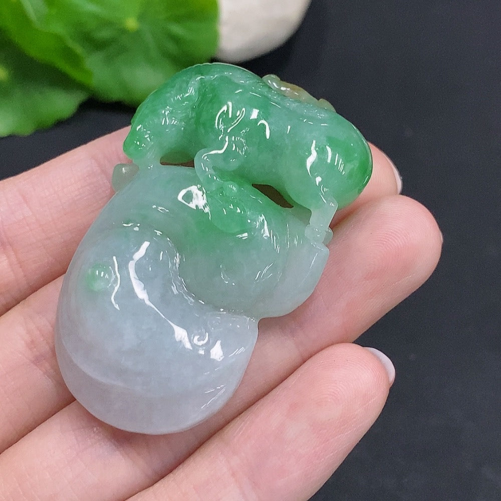 Huiliu Jadeite Turn the Tide Pendant featuring vibrant green jade with intricate carved design, certified by HUILIU HQ.