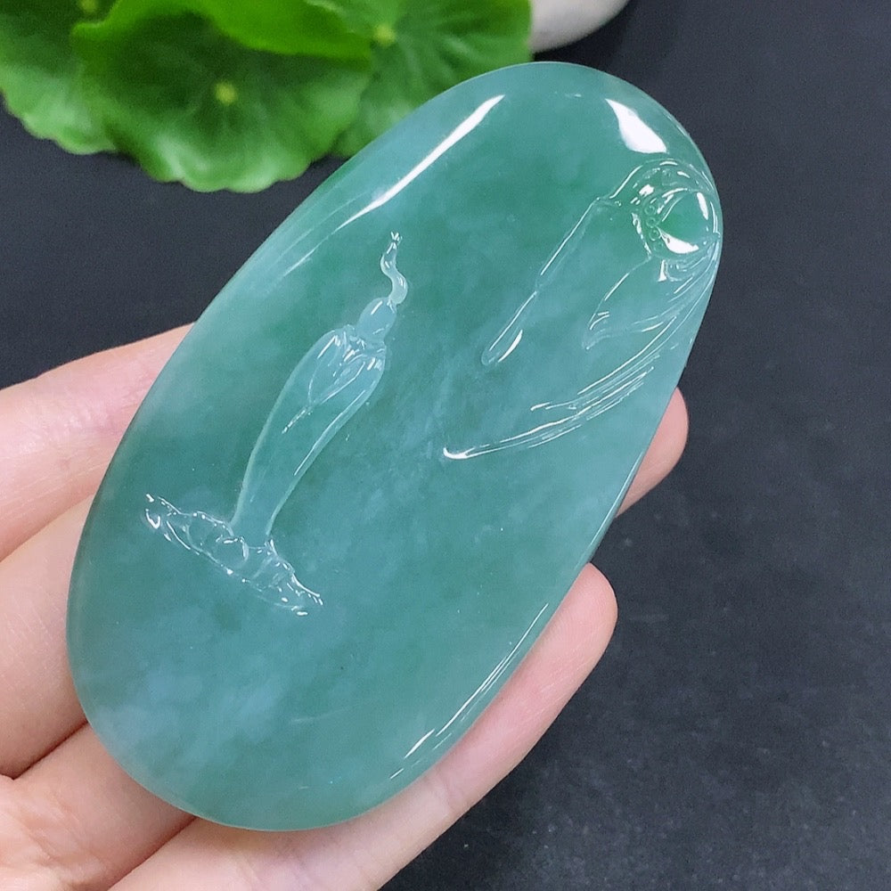 Jadeite Guanyin pendant with a formless design, crafted from green jade, featuring intricate carved details.