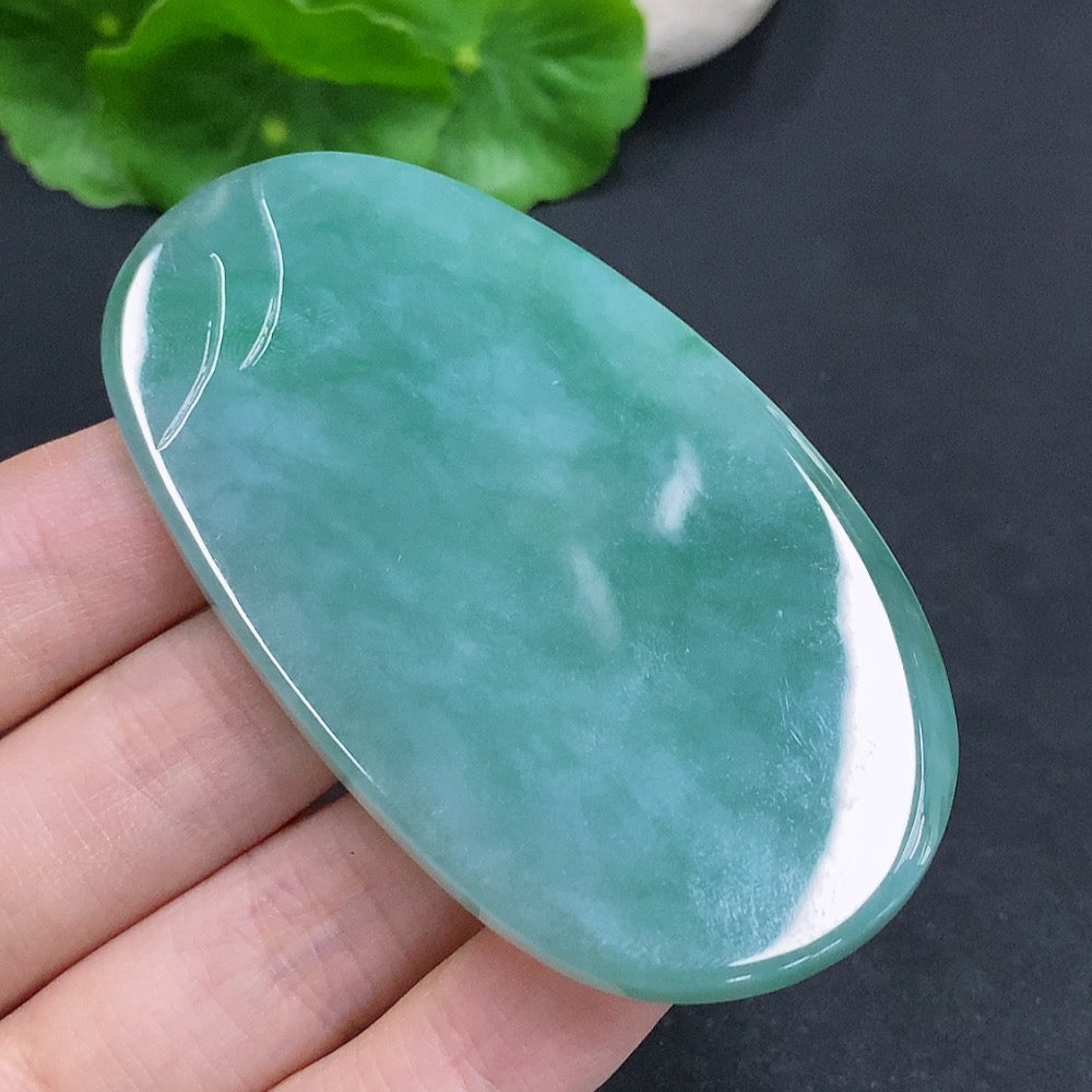 Jadeite Guanyin pendant with a formless design, crafted by HUILIU HQ, showcasing intricate jade carving and smooth surface.