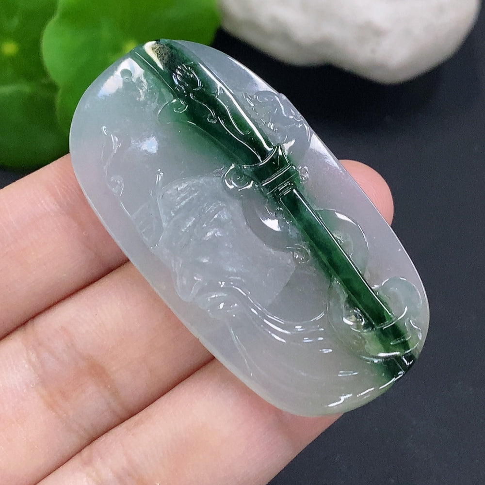 Jadeite Guan Gong pendant from HUILIU HQ featuring a detailed carved jade figure on a string cord.