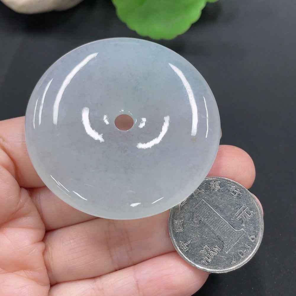 HUILIU HQ jadeite peace knot pendant, intricately carved jade jewelry, weighs approximately 46.96 grams, showcasing smooth, polished surface.