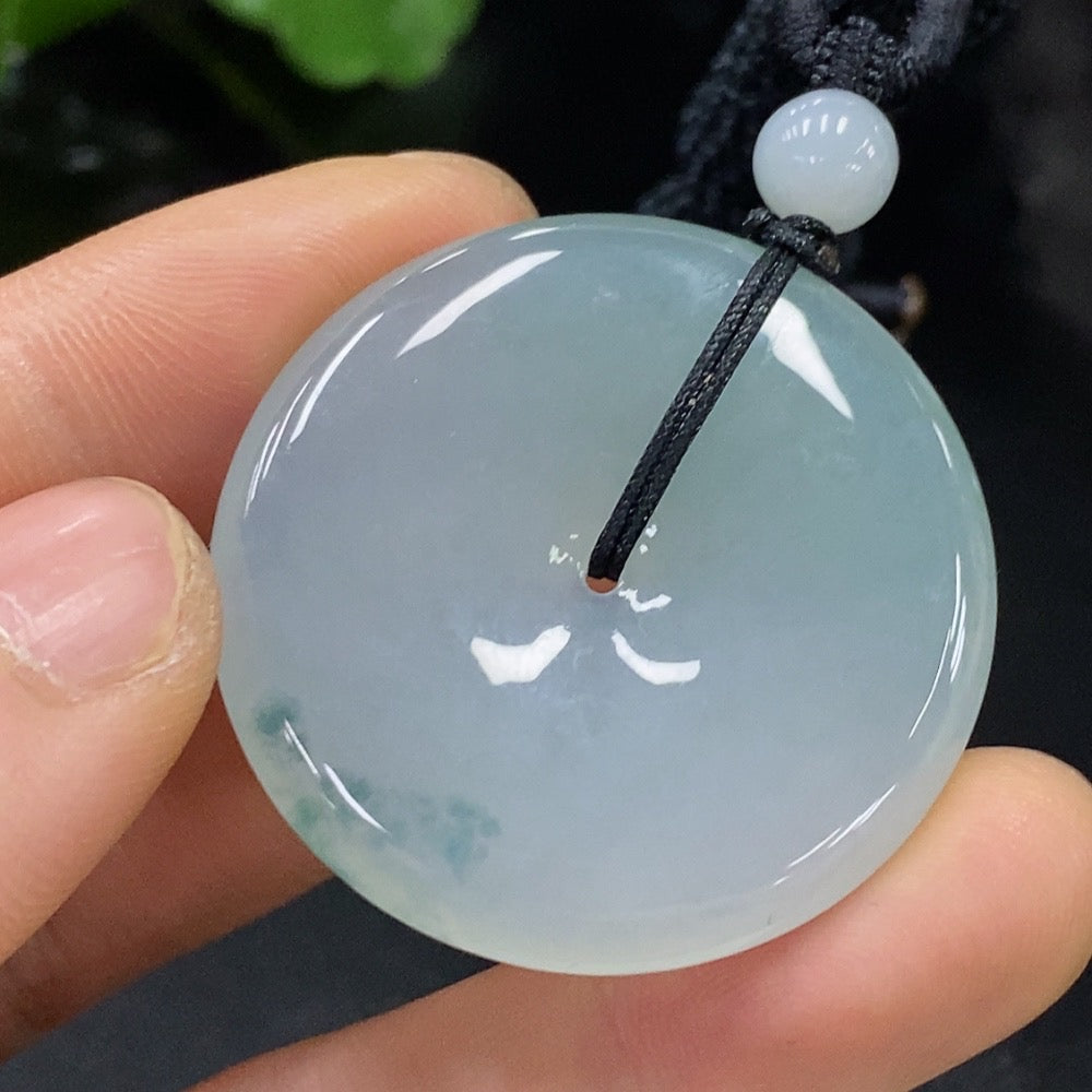 HUILIU HQ Jadeite Peace Pendant featuring a smooth, polished green jade pendant with carved peace symbol design.