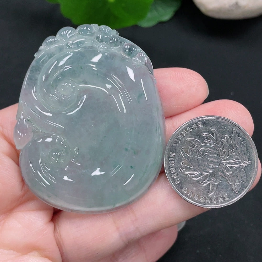 HUILIU HQ Jadeite Ruyi pendant, carved jade jewelry in natural green, weighs approximately 32 grams, close-up of detailed craftsmanship.