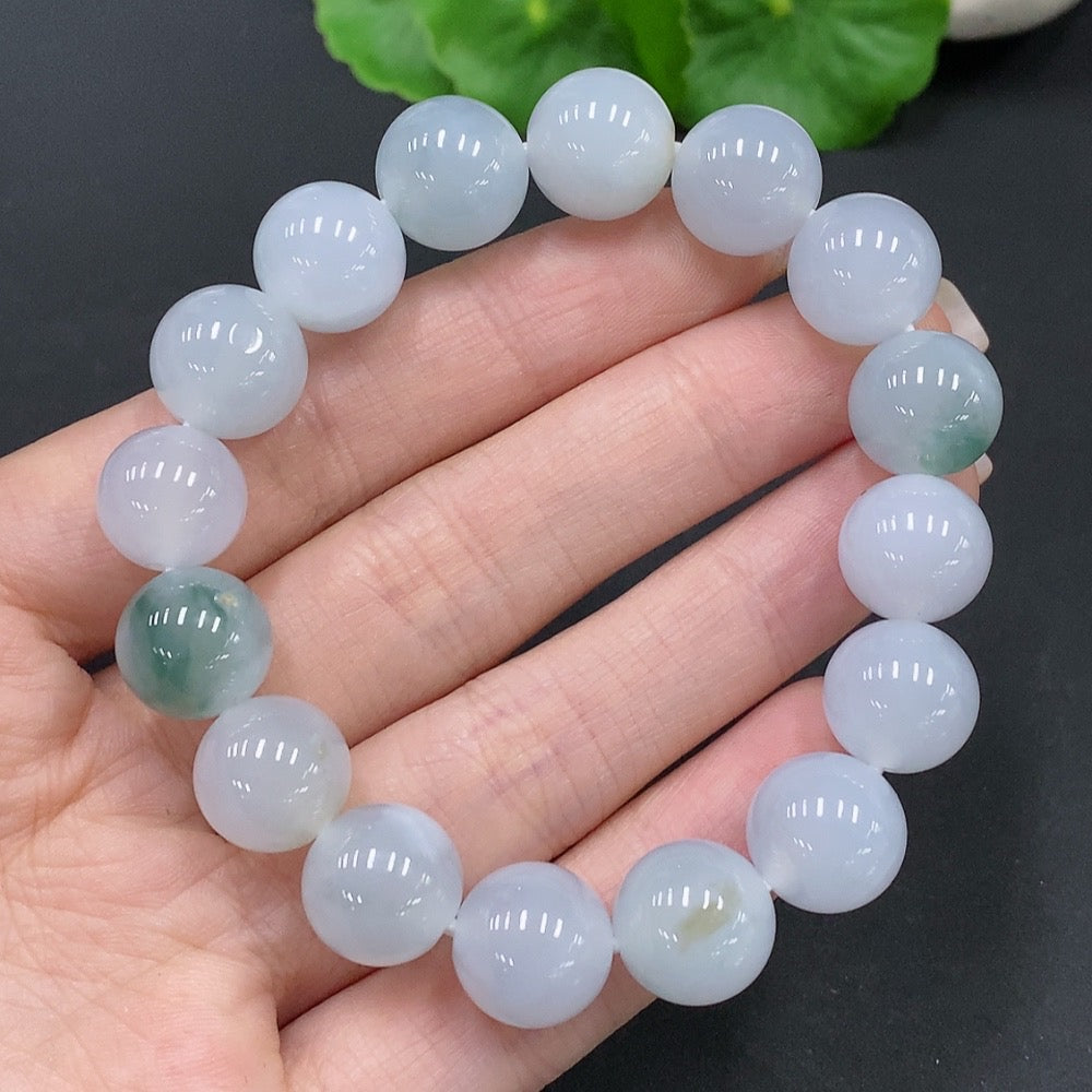 Huiliu certified Natural Grade A jadeite bead bracelet with 12.2mm round beads, showcasing smooth, polished jade jewelry.