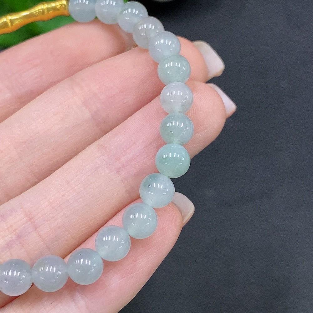 Natural Grade A Jadeite Bead Bracelet by HUILIU HQ featuring 5.8mm jade beads, authentic and certified jade jewelry.