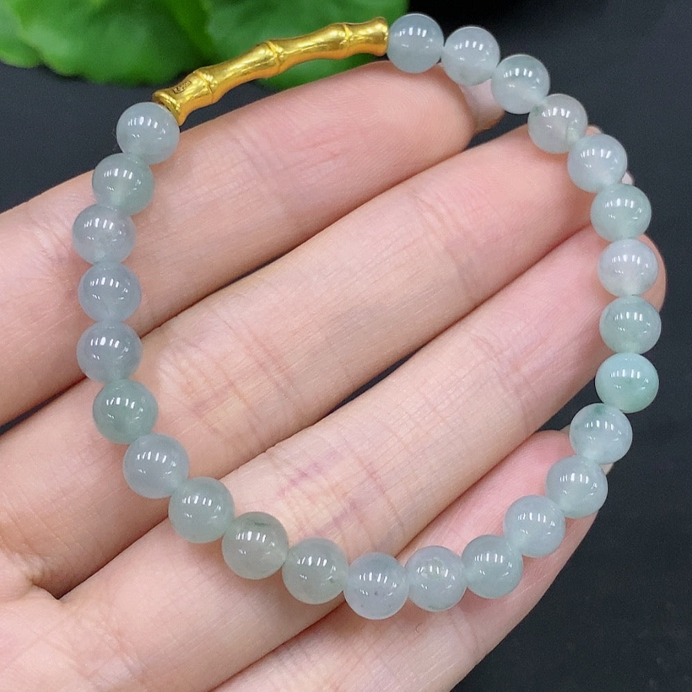Natural Grade A Jadeite bead bracelet by HUILIU HQ featuring 5.8mm jade beads on a stylish accessory bracelet.