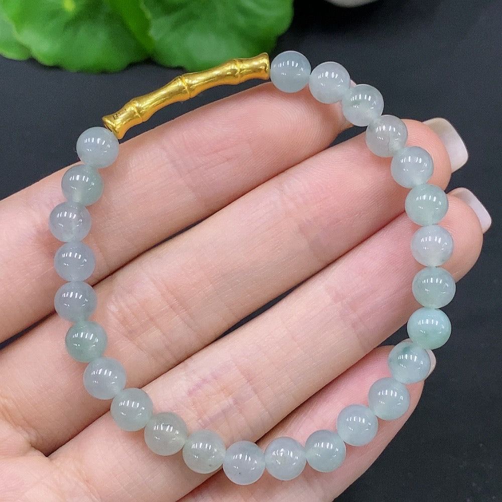 Natural Grade A jadeite bead bracelet by HUILIU HQ with 5.8mm jade beads, showcasing smooth, polished jade stones.