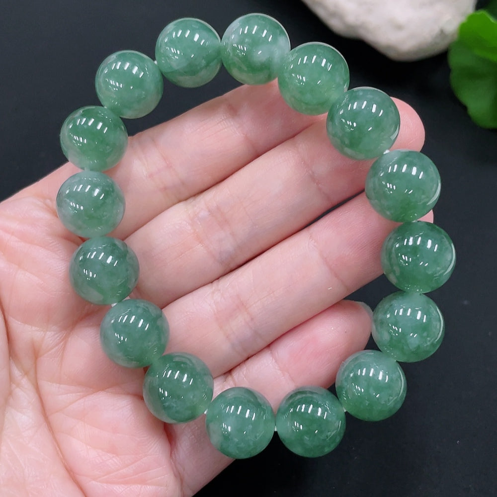 Natural Grade A Jadeite bracelet with 12.5mm beads, Huiliu certified, weighing approximately 52 grams, showcasing smooth, polished jade.