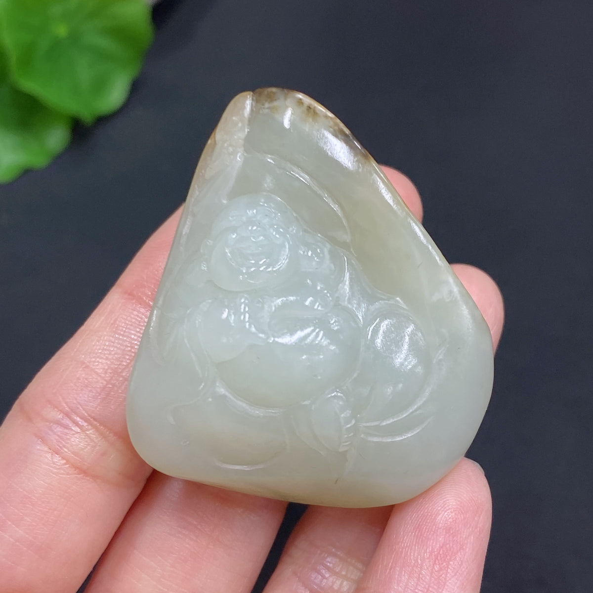 Natural Grade A Jadeite Buddha pendant with rope, HUILIU HQ certified, weighing 42.4g, showcasing smooth jade surface and detailed carving.