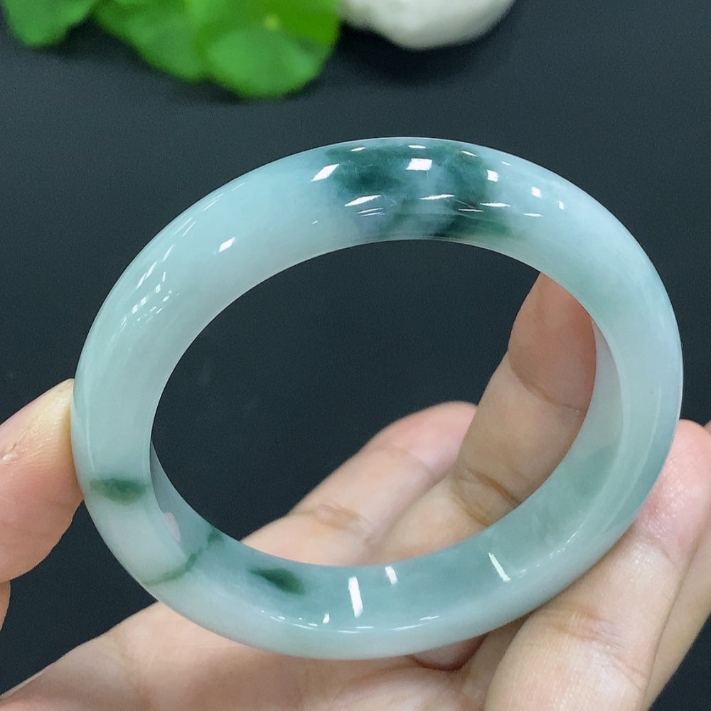 Natural Grade A jadeite bangle by HUILIU HQ, size 53.9, weight 56.9g, showcasing smooth, polished jade surface.