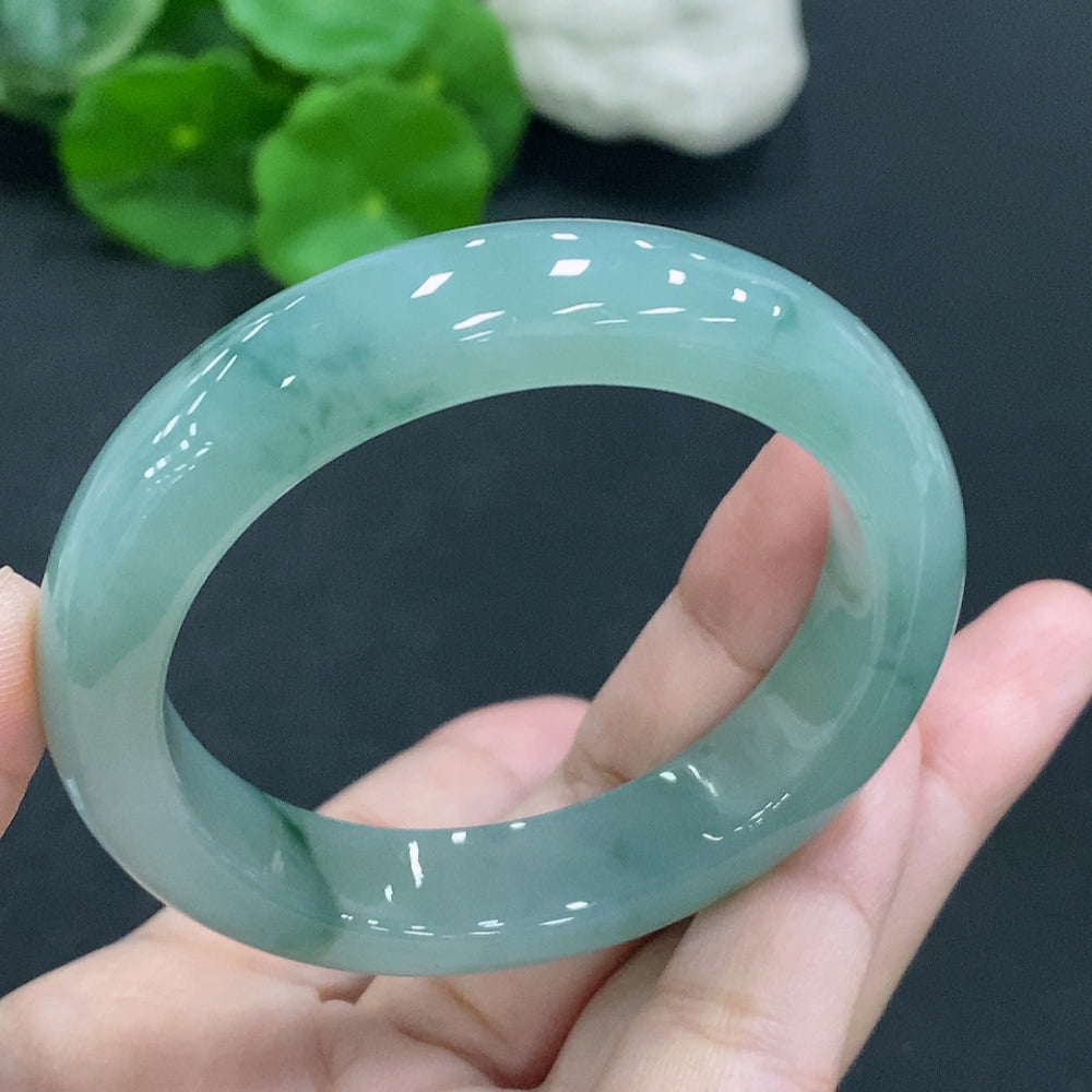 Natural Grade A jadeite round bangle from HUILIU HQ, size 50.8mm, approx. 51.8g, with a smooth polished surface and vibrant green color.