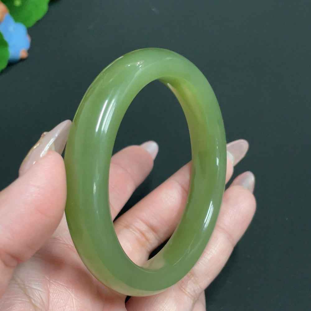 Natural Grade A Jadeite round bracelet by HUILIU HQ, featuring polished jade beads on a delicate string.
